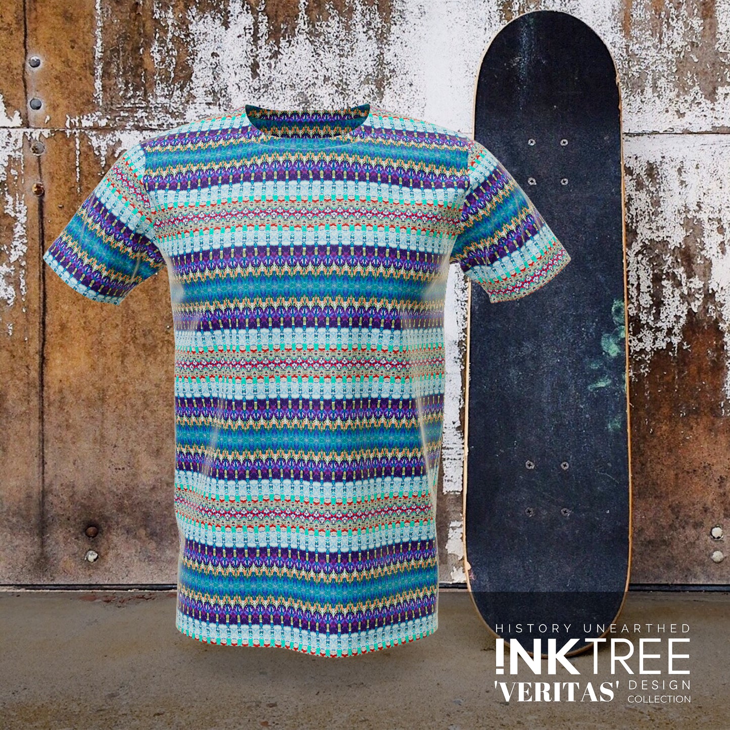 A blue, purple and green t'shirt, with a skateboard and rusty wall background.