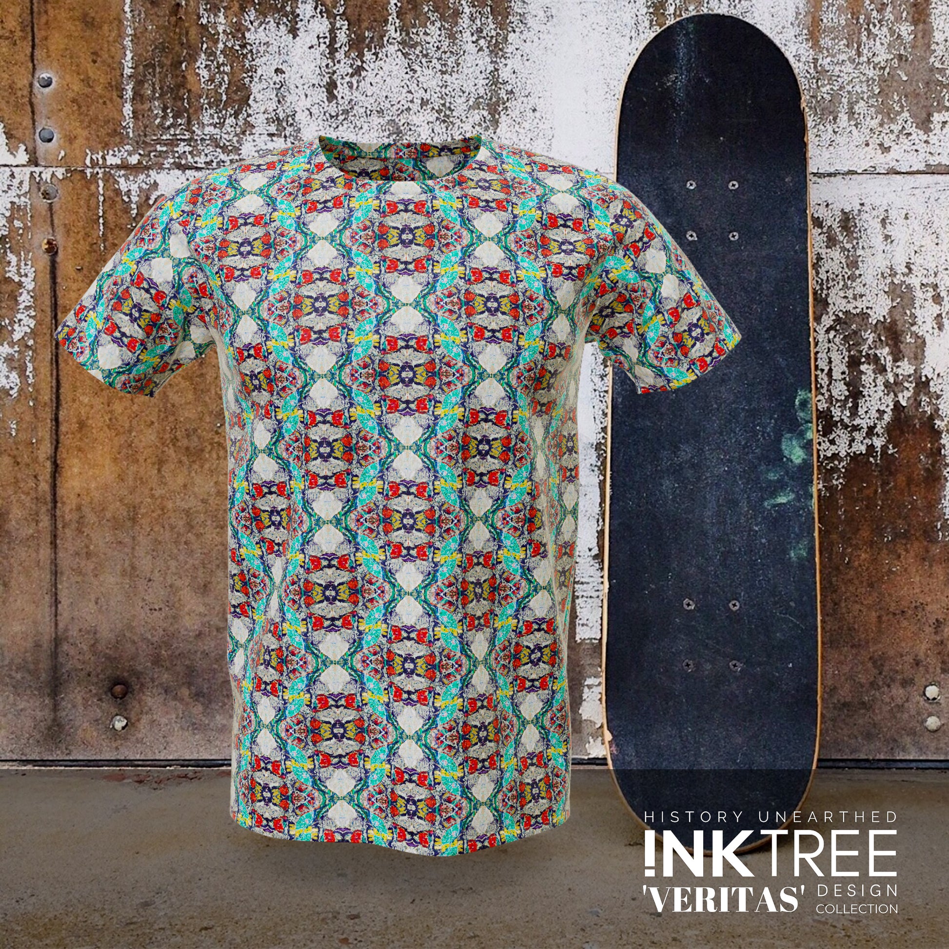  A blue, red and green t'shirt, with a skateboard and rusty wall background.